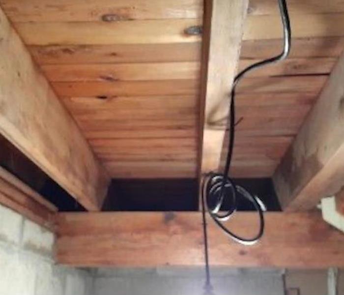 Clean wood beams in a basement