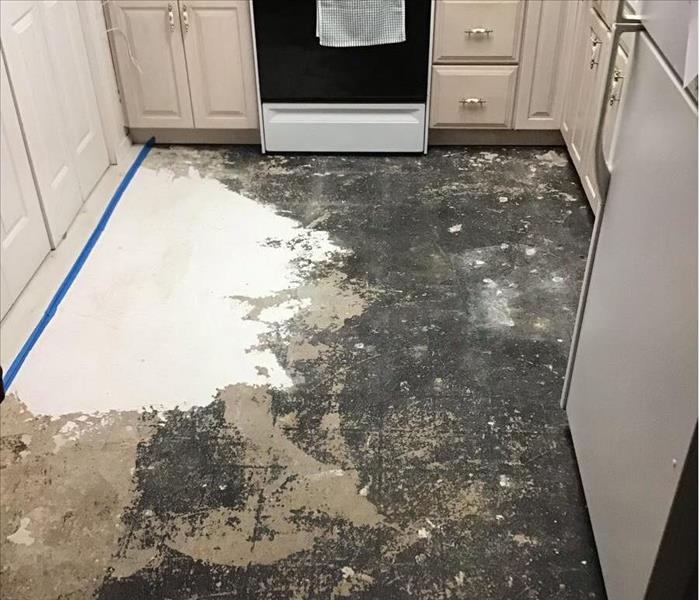 removed floor in water damaged kitchen