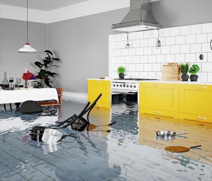 flooded kitchen with yellow cabinets