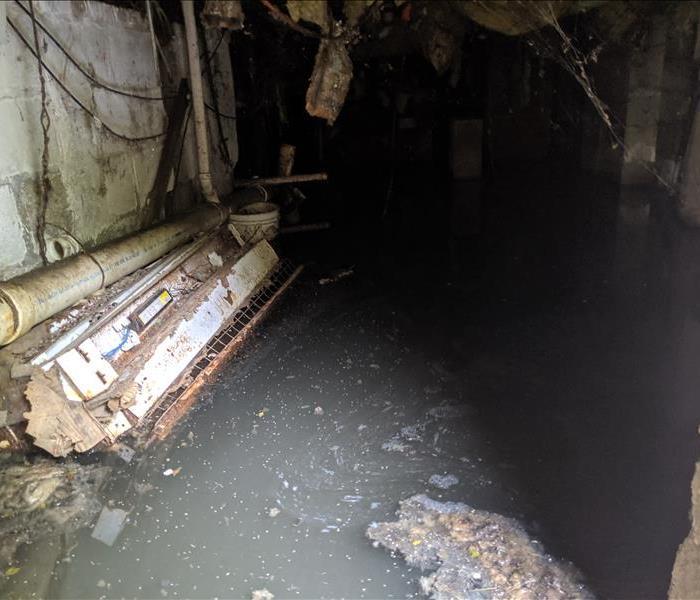 floodwater in crawlspace, plumbing visible