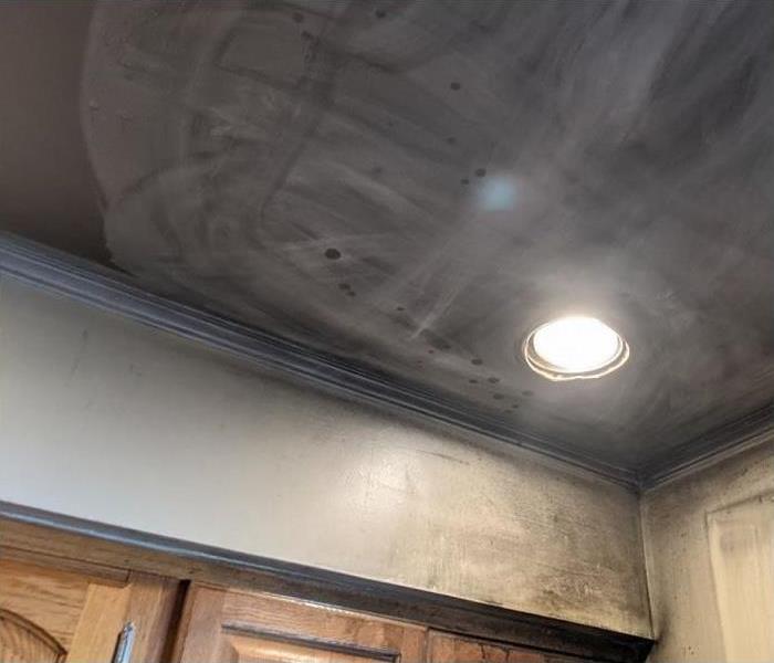 heavy smoke and soot on ceiling and wall