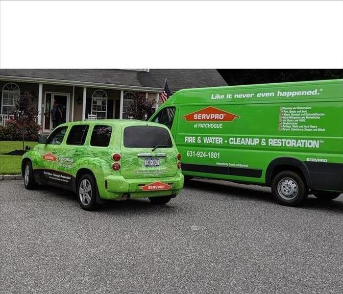 SERVPRO vehicles parked in front of home